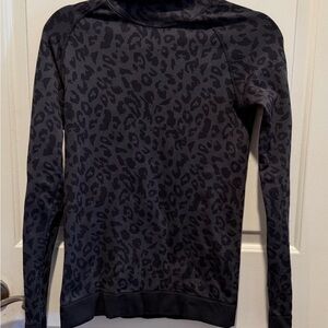 Sweaty Betty leopard print pullover top.